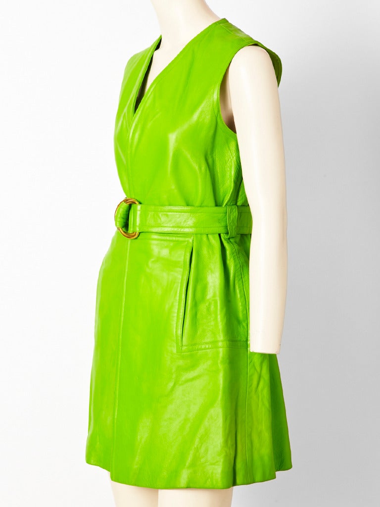 Bonnie Cashin, lime green, sleeveless, wrap style, belted jumper with side pockets.