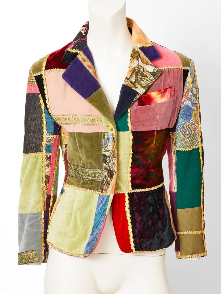 Dolce and Gabbana, patchwork blazer and matching vest. The patchwork vest, and fitted jacket is composed of squares of velvets, and tapestry-like fabrics. The patchwork squares are outlined in various metallic braiding and ribbon.