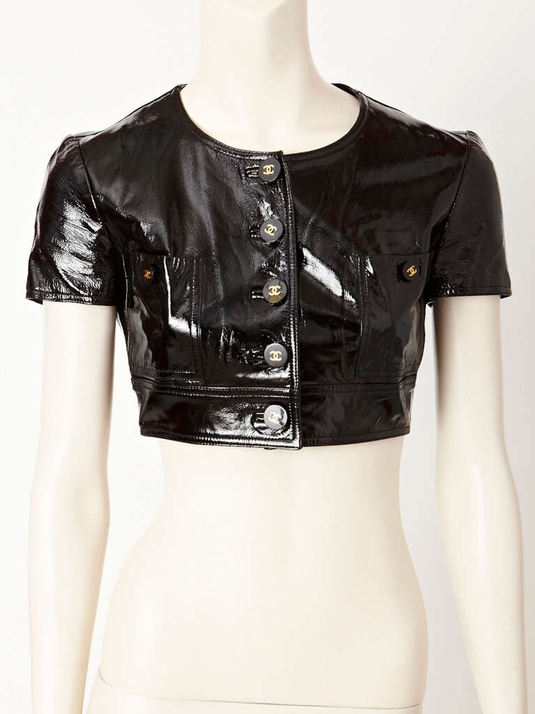 Chanel, black patent, short sleeve, fitted,, cropped jacket with breast pockets.