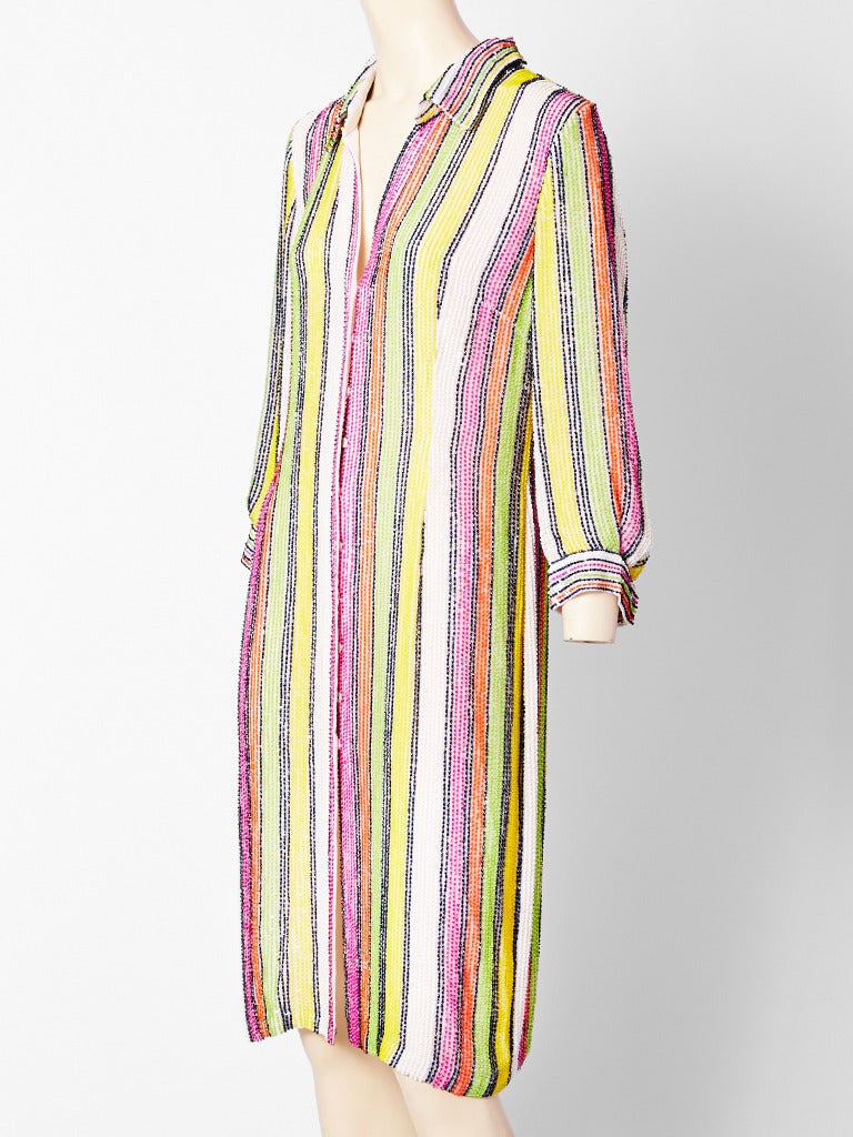 Oscar de la Renta, colorful, beaded, stripes on ivory chiffon, long sleeve, slightly fitted shirt dress. Dress closes with hidden snaps.