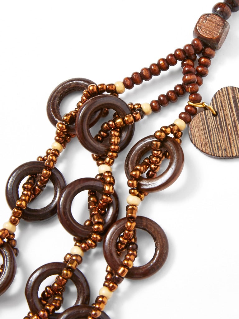 Yves Saint Laurent, African inspired, copper glass beads with wood rings 3 
stranded necklace. Heart tag has 