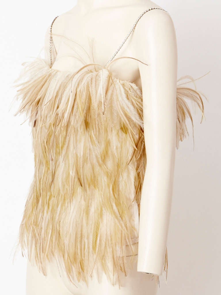 YSL, tiered, ostrich, feathered camisole in natural tones of ivory and pale beige.
Straps are made of rhinestones. Lined in beige organza. Feathers are applied by hand.