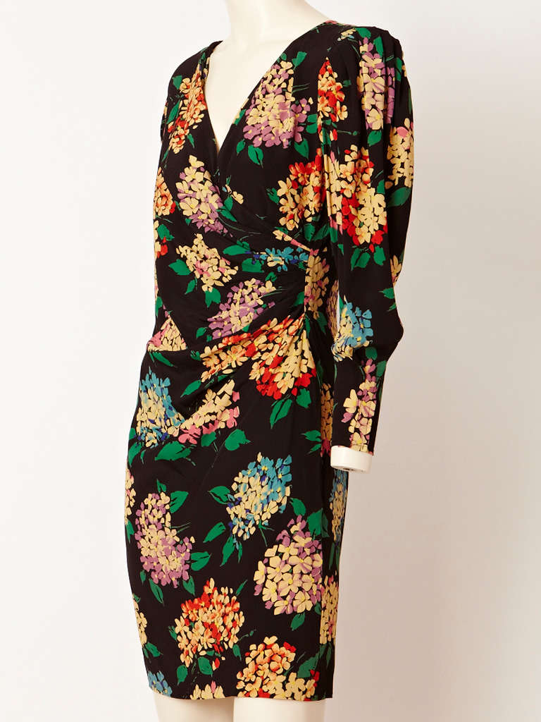 Ungaro, silk, colorful, Hydrandga pattern on black ground, long sleeve dress with
draping at the waist and hip.