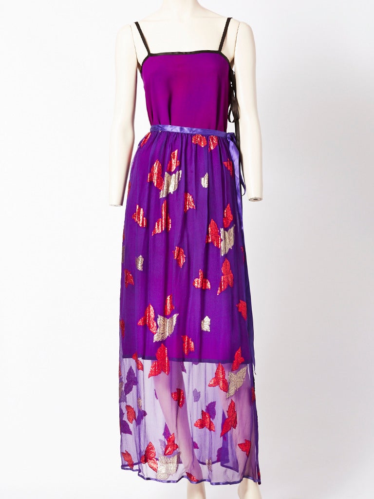 Yves Saint Laurent, purple chiffon and silk crepe 3 piece layered ensemble.
Having a long open jacket, kimono style, in a printed chiffon lame, trimmed in purple satin with the purple satin ribbon tie at the neck. There is a solid purple, silk