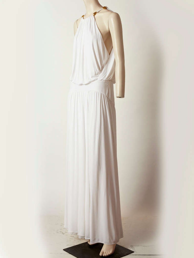 Roberto Cavalli, white matter jersey Grecian inspired gown , with halter neckline. open at the sides and draped bodice.  Yoke at the hips with gathered skirt..