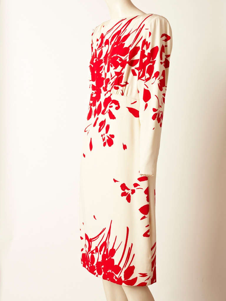 Galanos, red and ivory, floral, pattern ,silk crepe dress with empire waist. Sleeves narrow at the wrist with zipper closures. Body of the dress is straight.