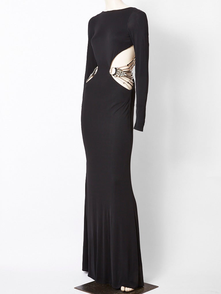 Gucci, black, jersey, long sleeve, bias cut, evening gown with cut out sides exposing the skin. The 