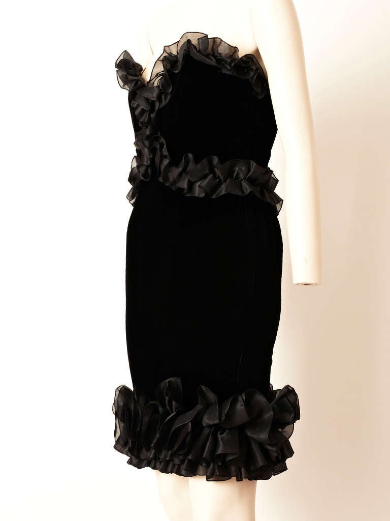 YSL, black, velvet fitted, strapless cocktail dress with organza, ruffled detail on the bodice and hem.