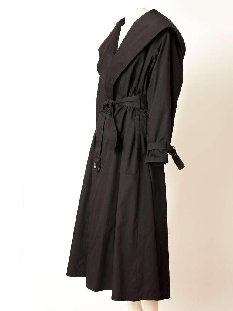 YSL, black, flared, belted french with a wide shawl like collar that turns into a hood in the back.