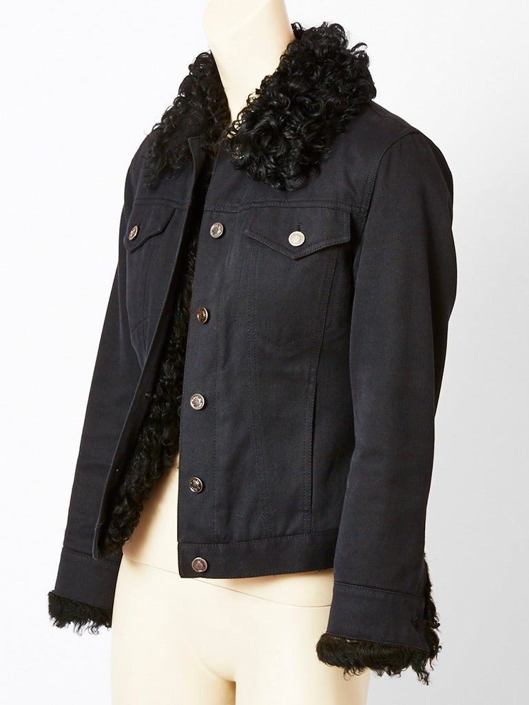 Tom Ford for Gucci, black denim, fitted, jeans jacket lined in black curly lamb,
with a curly lamb collar. Late 90's.