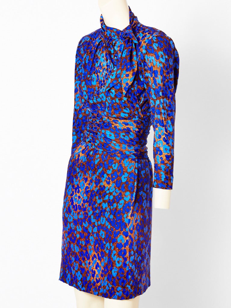 YSL, colorful silk, long sleeve, leopard, print day dress in shades of violet and brown, having a slim silhouette with a tie at the neck with some draping at the bodice and a cummerbund at the waist.