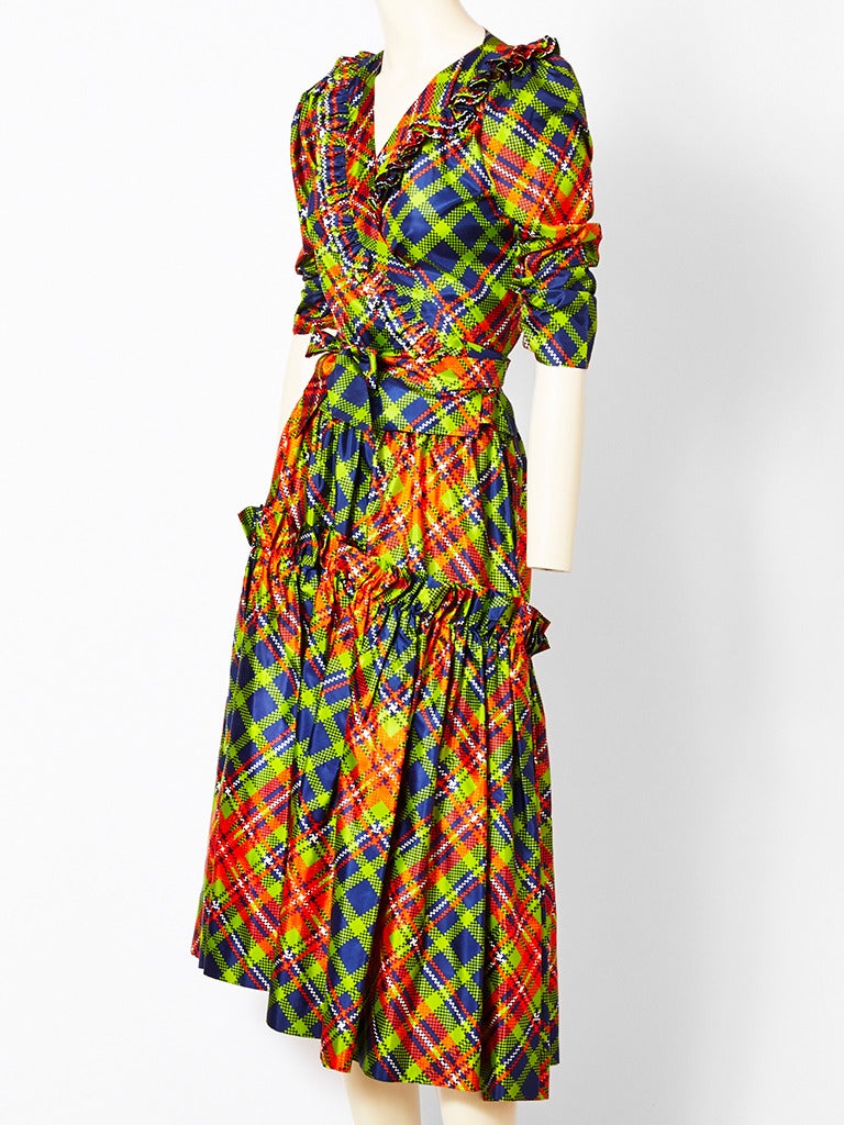 Yves Saint Laurent, silk plaid 2 piece ensemble, late 70's. Fitted wrap top that 
ties at the waist, with ruffle detail. Skirt is gathered and tiered.