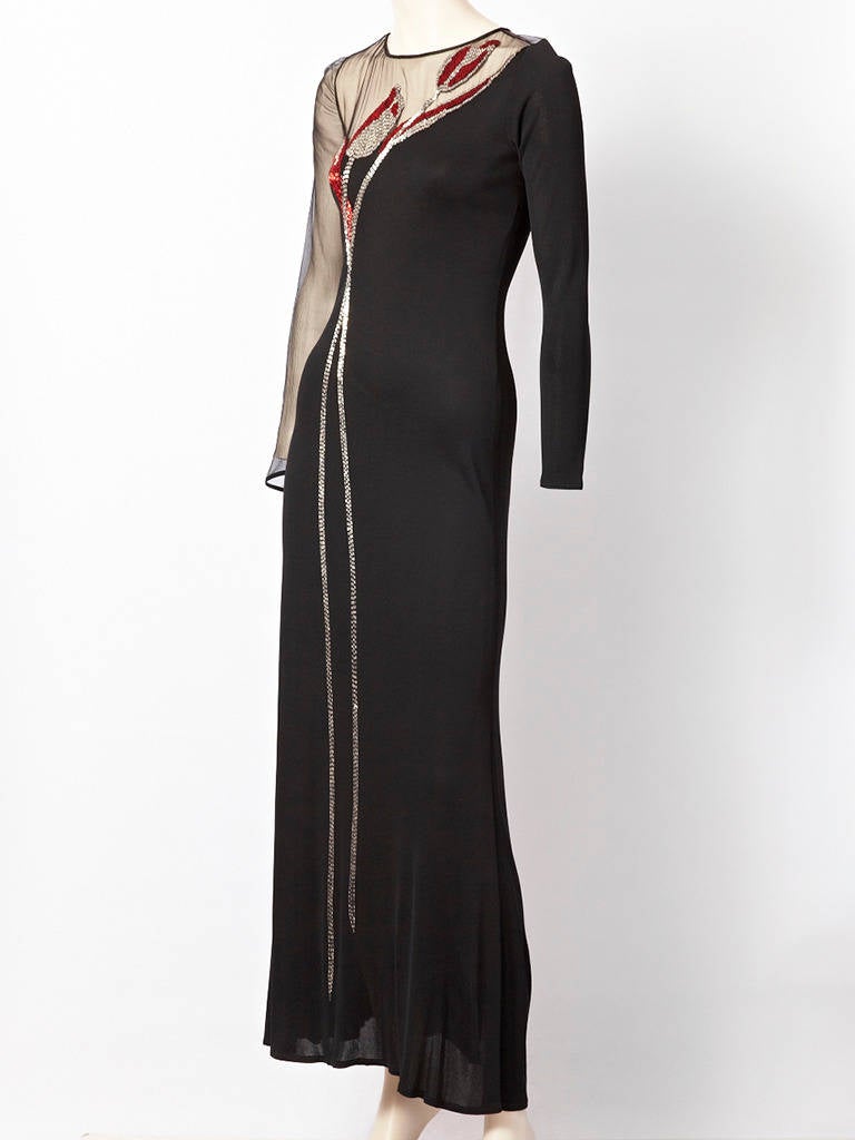 Tracy Mills, matte jersey, fitted, evening dress with illusion neckline and one sleeve.
Red and silver bugle beads form a Tulip pattern from hem to shoulder.