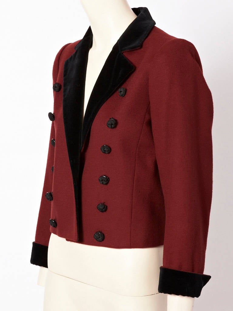 Yves Saint Laurent, burgundy,wool, fitted, military style, cropped jacket with
velvet collar and cuffs and double breasted passementerie buttons.