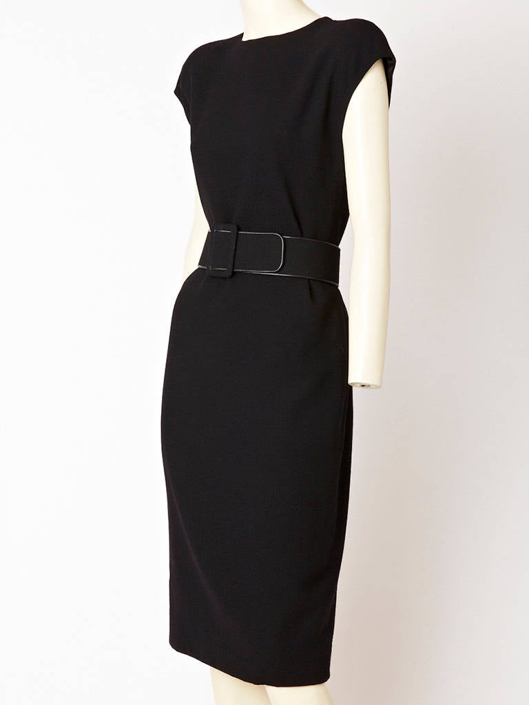 Galanos Black wool crepe bias cut belted sheath dress with cap sleeve.
Elegant and simple silhouette.