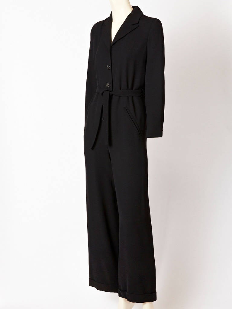 Givenchy Black wool crepe Jumpsuit with back inverted pleat detail.
Simple masculine silhouette.