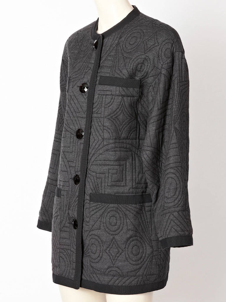 YSL, grey, quilted, wool, mandarin style jacket with geometric, pattern quilting and deep pockets.
Jacket is trimmed in wide gross grain ribbon and has faceted jet buttons.