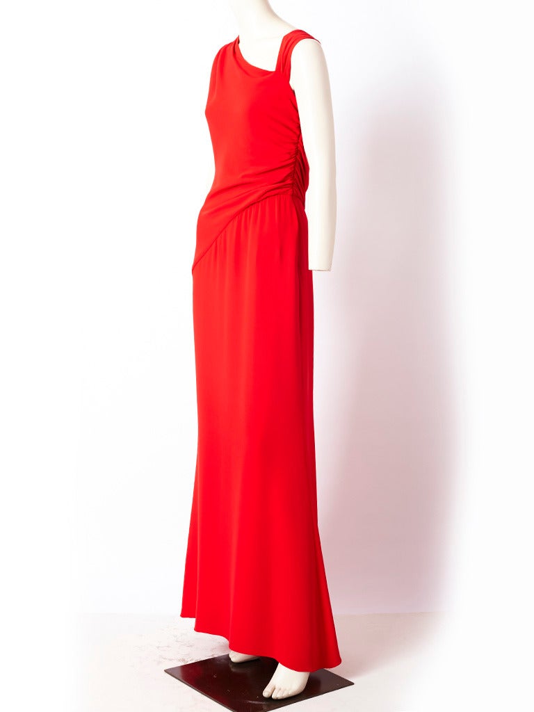Valentino, signature red, silk crepe, grecian inspired, evening gown, with one shoulder detail and draping at the bodice.