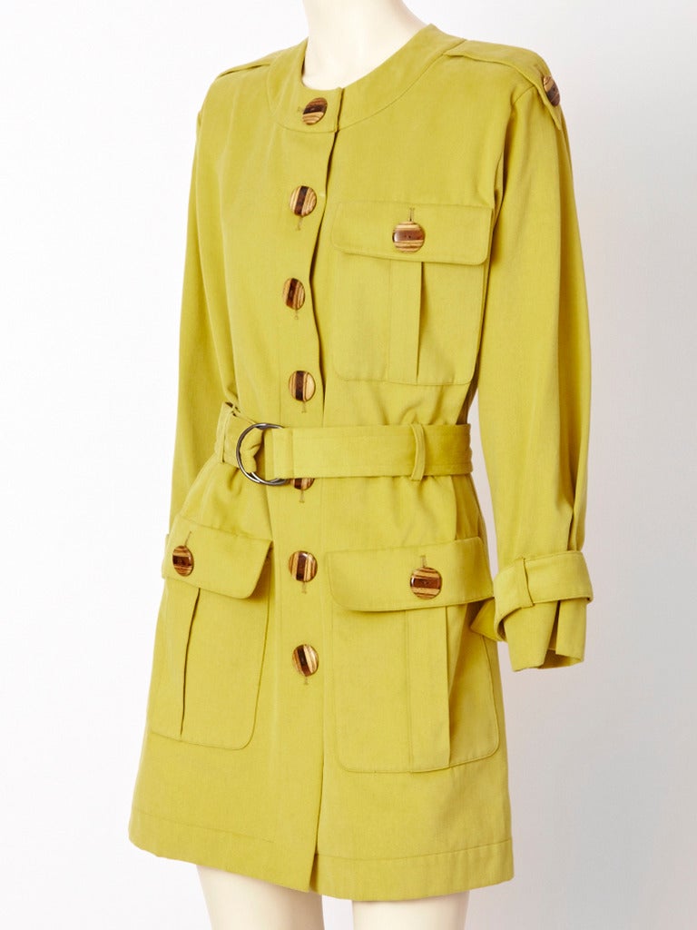 YSL. brushed cotton, pale chartreuse, collarless, safari jacket with epaulettes and wood buttons detail. Can be worn as a mini dress. Single breast pocket and deep pockets below the hips.