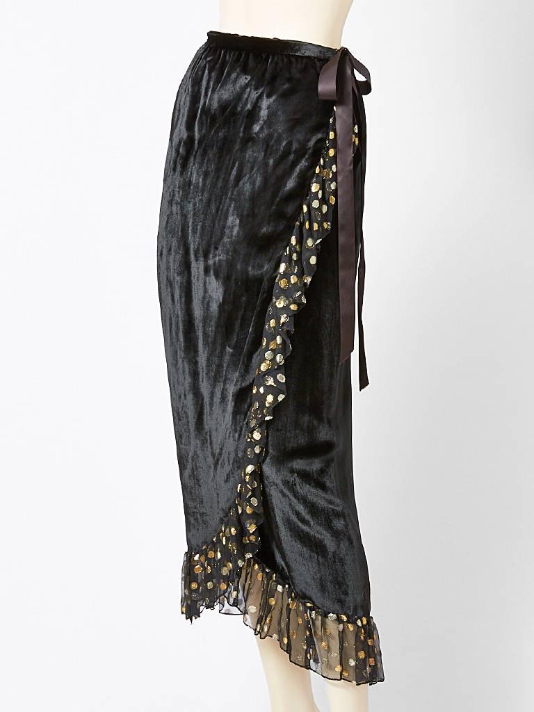Yves Saint Laurent, panne velvet, wrap skirt, with a chiffon, and gold lame,
dots ruffle detail.