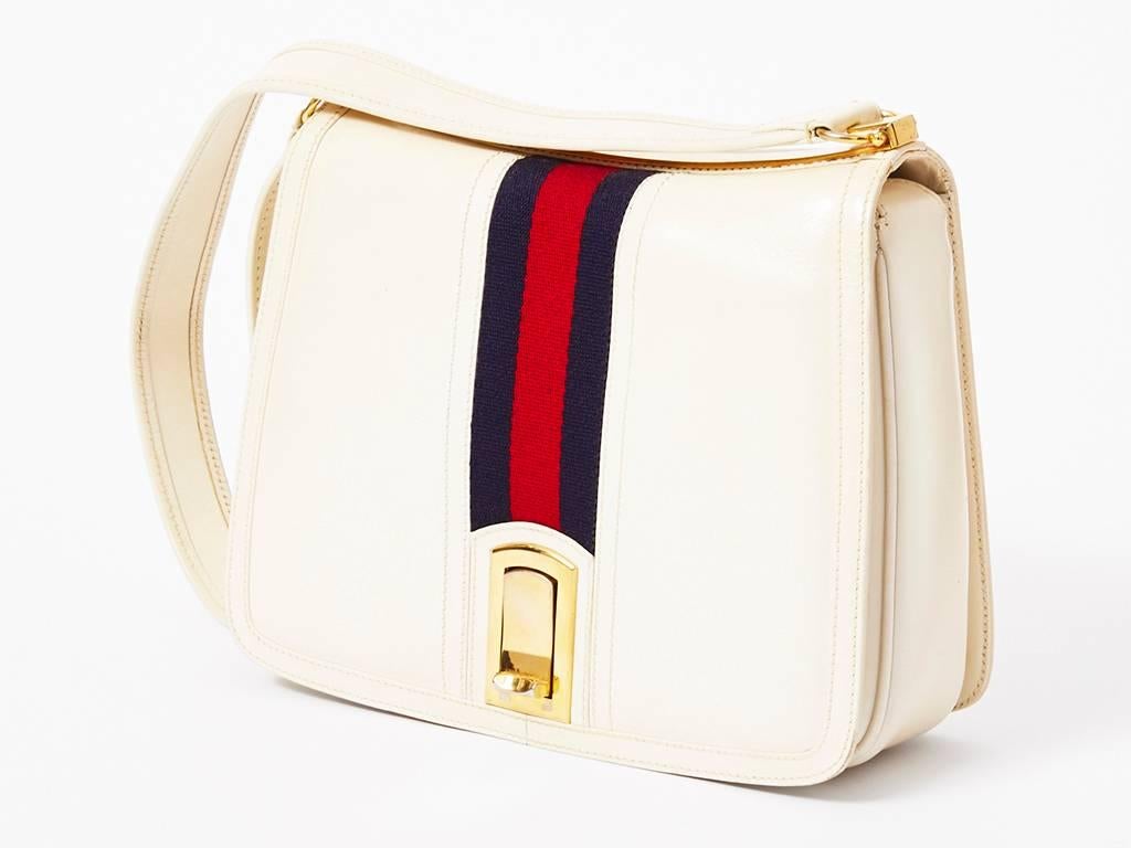 Gucci, leather shoulder bag, in off white with signature Gucci stripe. Gold hardware, with top stitching detail. C. 1970's.