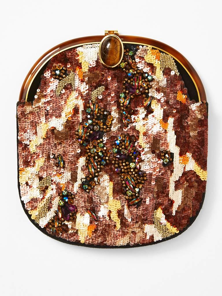 Isabel Canovas, beaded and sequined, evening bag with a long gold chain.
Front of bag is an abstract sequined design in shades of bronzes, and coppers.
Center of the bag has a beaded abstract design layer. Frame is gold and enamel. Clasp is a