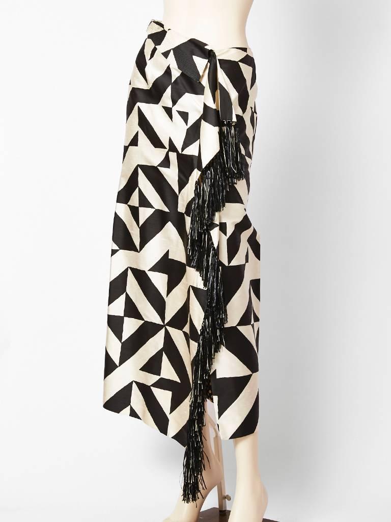 Gianfranco Ferre, black and white, graphic print, silk skirt with a raffia and silk 
fringe detail going down the side.