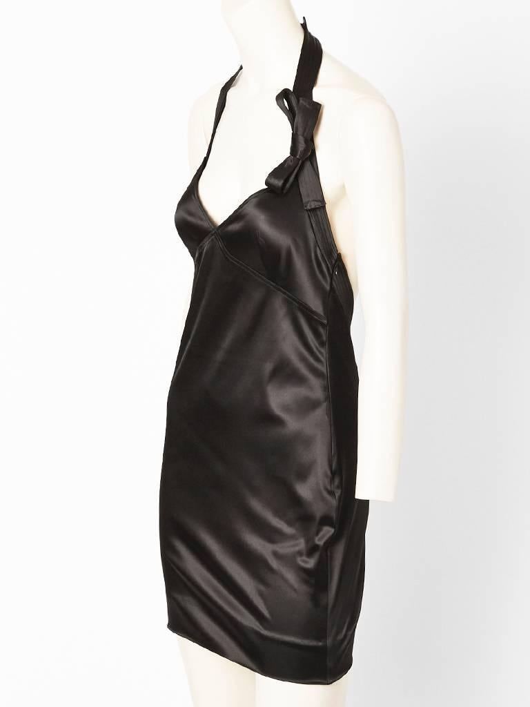 John Galliano for Dior stretch satin, halter neck cocktail dress. Sexy, fitted bodice. Neckline has a bow detail above the bust. Back is completely open.