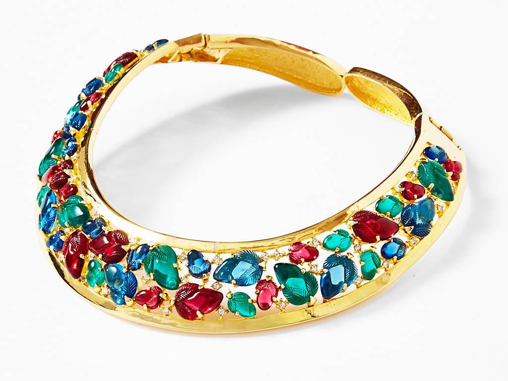 Lanvin, costume, collar necklace, having detailed, faux, Cabouchon, stones with carved, leaf pattern stones in tones of Ruby, Emeralds, and  Sapphires. Between the stones there are tiny rhinestones.