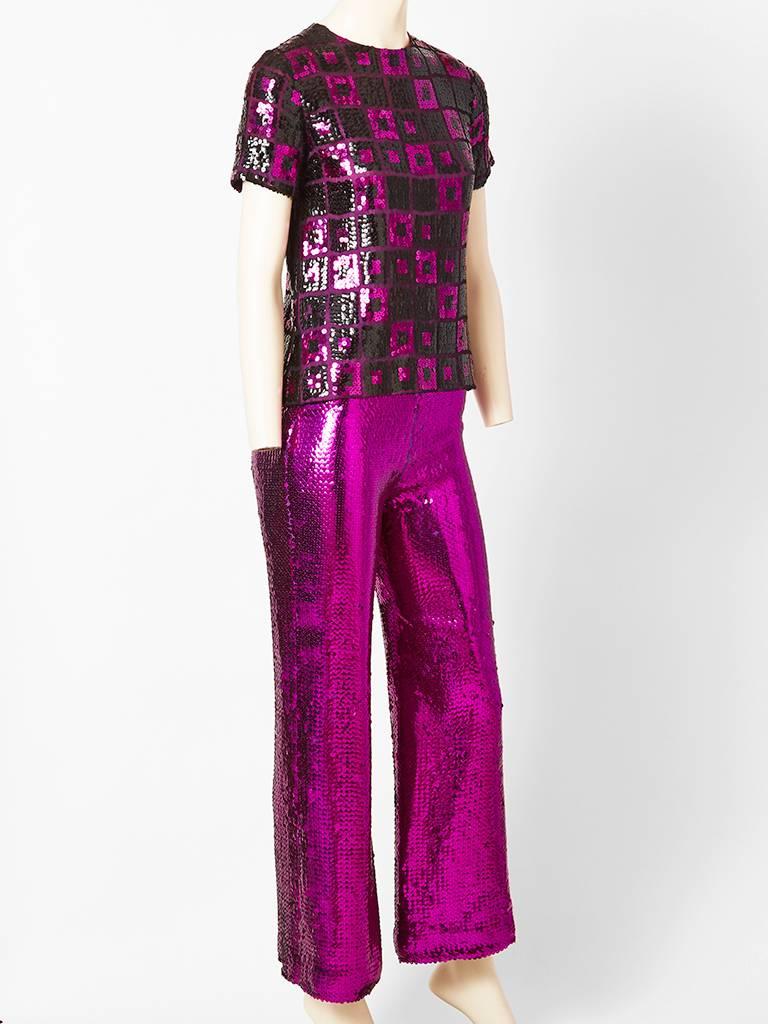 Dior Boutique, ( Marc Bohan ), 1960's 2 piece sequined pant, evening. ensemble. Mod period. Tee shirt like top, with short sleeves, that zips up the back, having a graphic squares, pattern. Purple, sequined pant that flares, with a back center