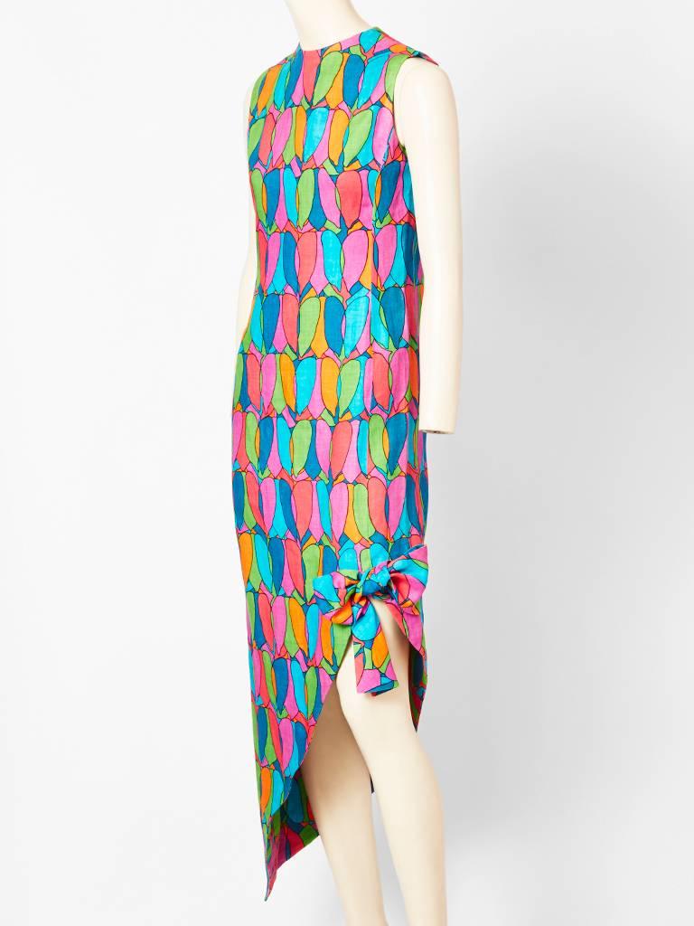 Geoffrey Beene, 60's, colorful, linen, abstract ,heart pattern day dress.
Collarless, sleeveless, having an asymmetric pointed hem with a bow detail.
Crisp lines..Easy to wear... 