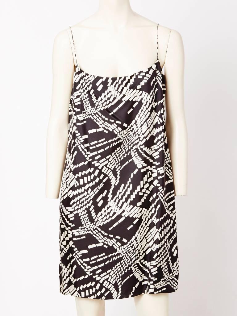 Mila Schon, black and white pattern, chiffon, one shoulder dress with any asymmetric hem. Dress comes with a silk slip having the same pattern as the dress that is worn under the chiffon. The slip can also be worn separately on its own.