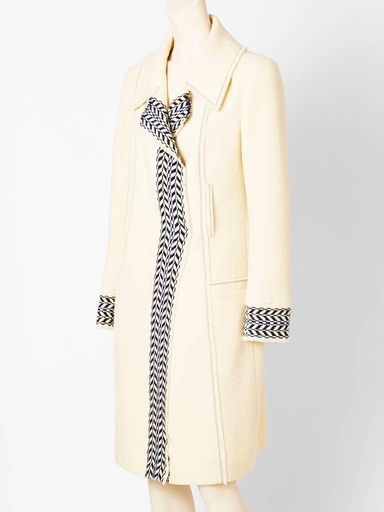 Chanel, ivory, wool boulce , open coat ( no fastening), with navy blue chevron,
patterned, stitched detail. Small collar, breast pockets with hidden side pockets. Lined in silk charmeuse.