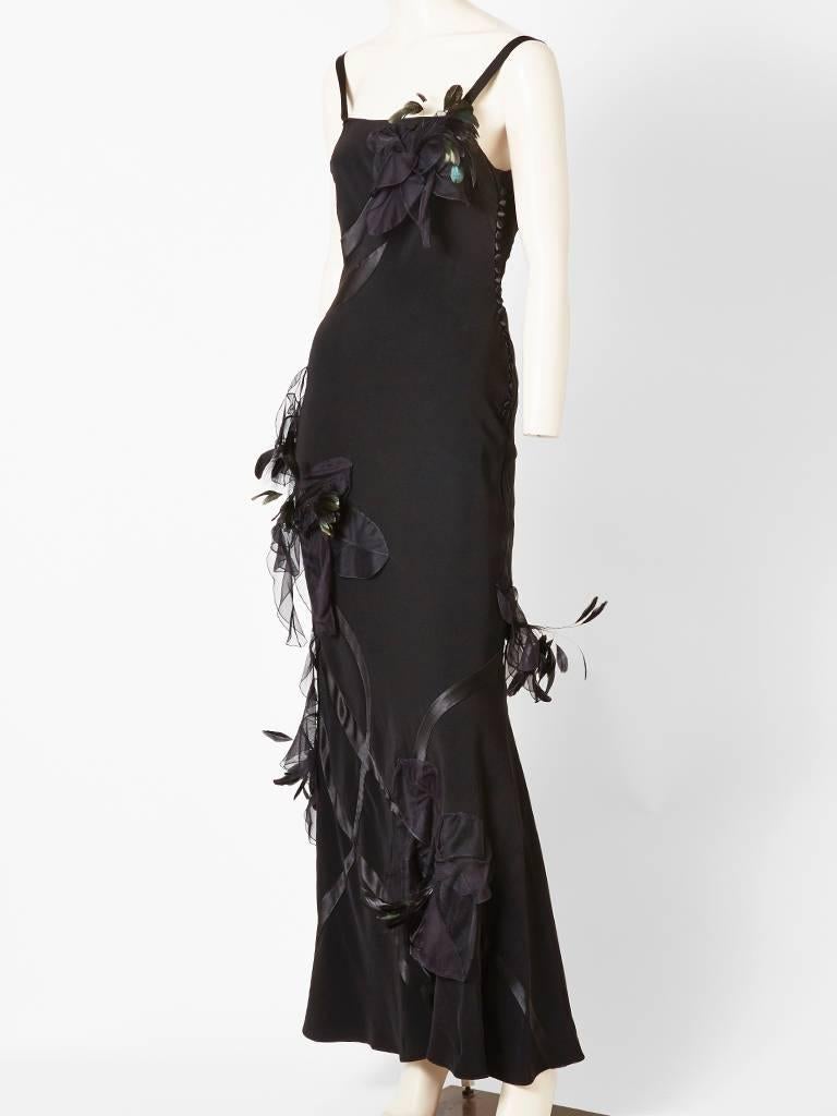 John Galliano, silk crepe, bias cut gown with satin asymmetric appliques.
Dress has thin straps with sculpted 3 dimensional flowers randomly placed having coq feather detail. 