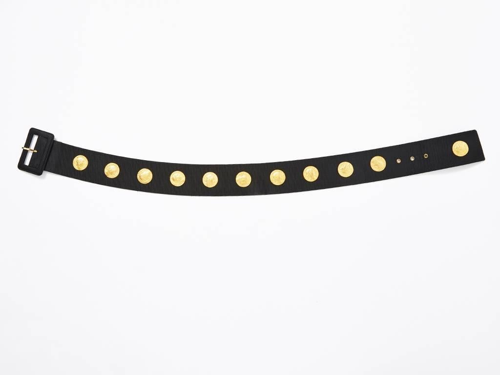 Yves Saint Laurent, black, gross grain belt with roman coin embellishment. Belt is curved so that it sits at the waist properly.