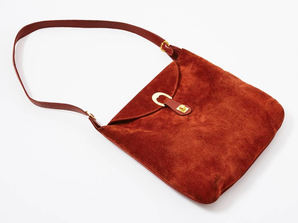 Gucci, rust tone, suede,  shoulder bag with leather details. Adjustable strap with 