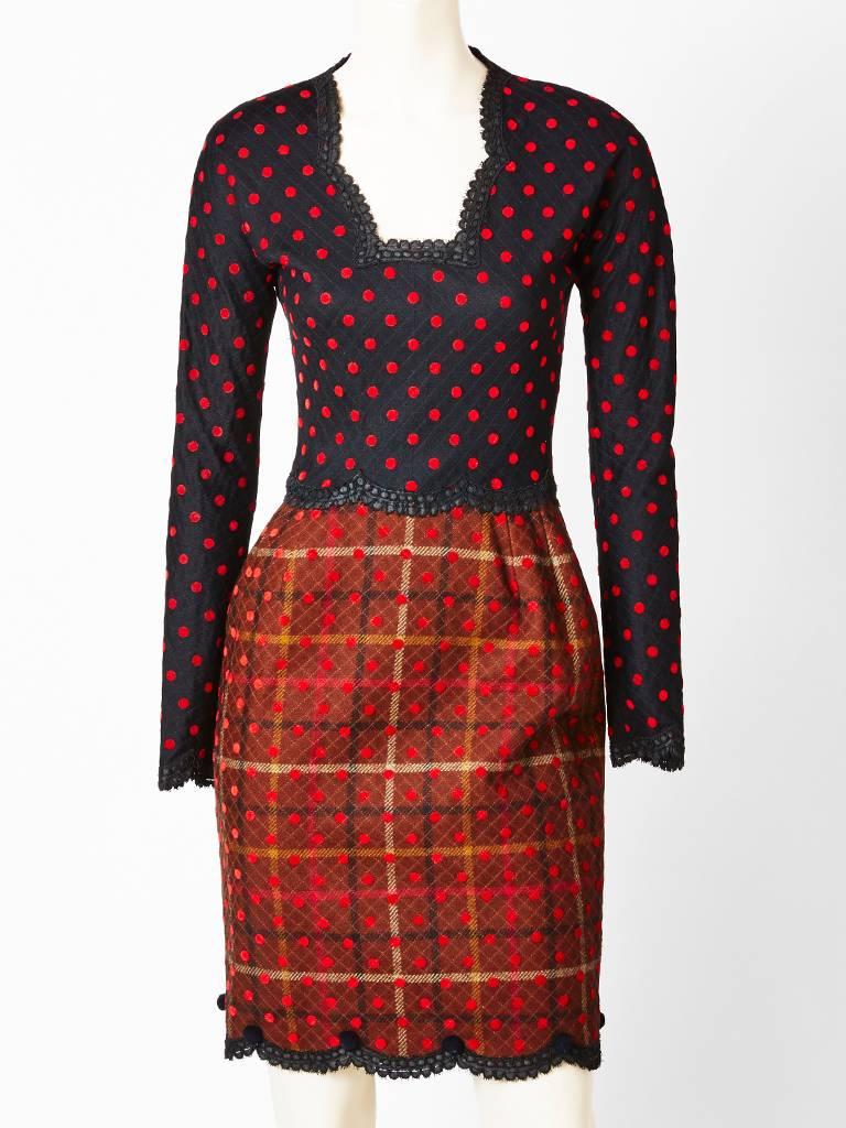 Geoffrey Beene, quilted, wool, plaid and polka dot jacket and dress ensemble.
Dress has a fitted bodice, long sleeves, and an open neckline. Bodice has a black and red polka dot fabric with lace trim detail.Skirt of the dress is slightly gathered