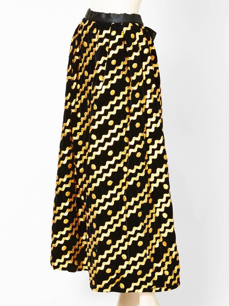 Adolfo black, velvet, gathered,  long evening skirt, embellished with gold appliqued ric rac diagonally placed and gold embroidered dots. Satin waistband that ties in the back.