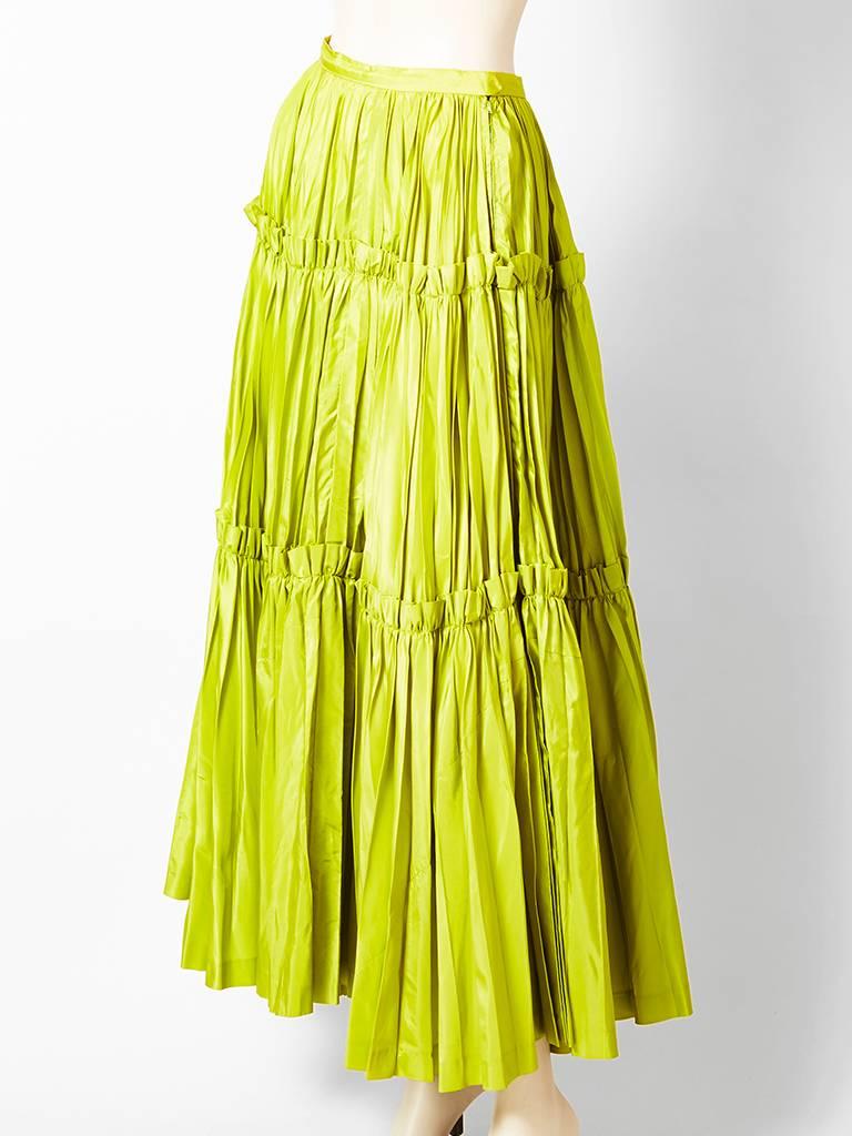 Yves Saint Laurent, chartreuse, 3 tiered taffeta, gypsy skirt, C. late 70's.
Each tier is gathered, including the waist.