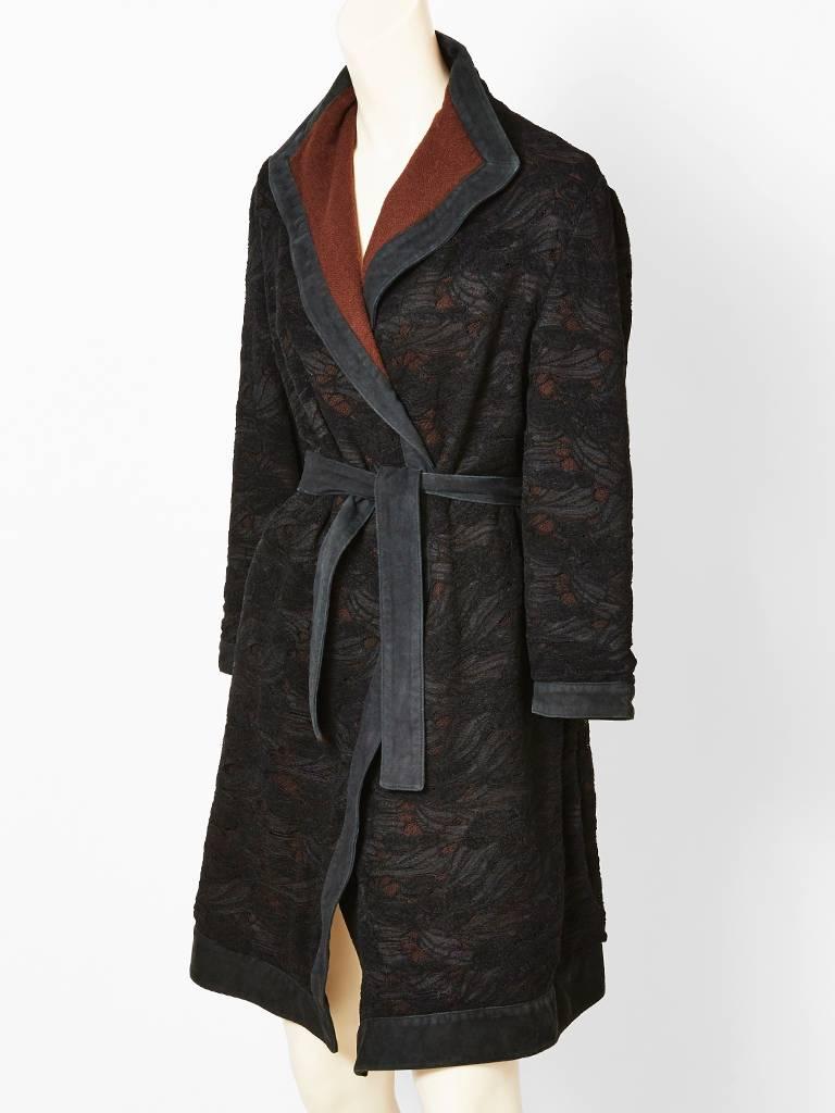 Versace, wool knit belted wrap coat with a lace overlay. Wool knit, in a dark brown, with a black lace overlay. Trimmed in suede with a suede belt.