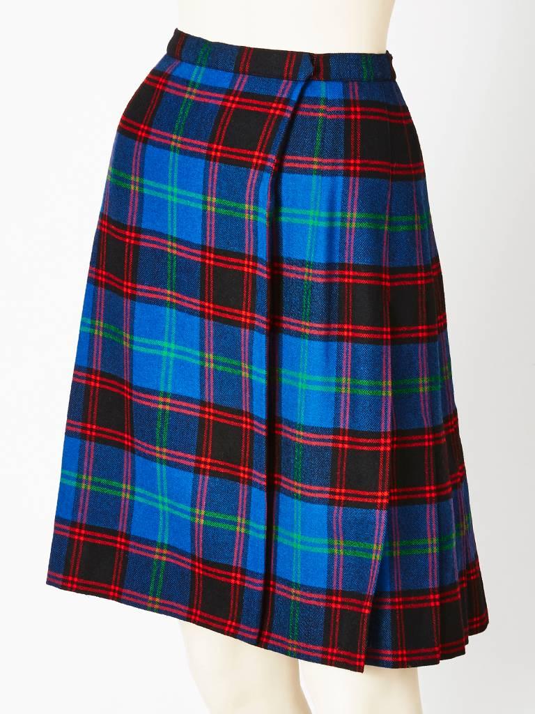Yves Saint Laurent, plaid, wool kilt in tones of cobalt blue, green, red and navy.
Classic 