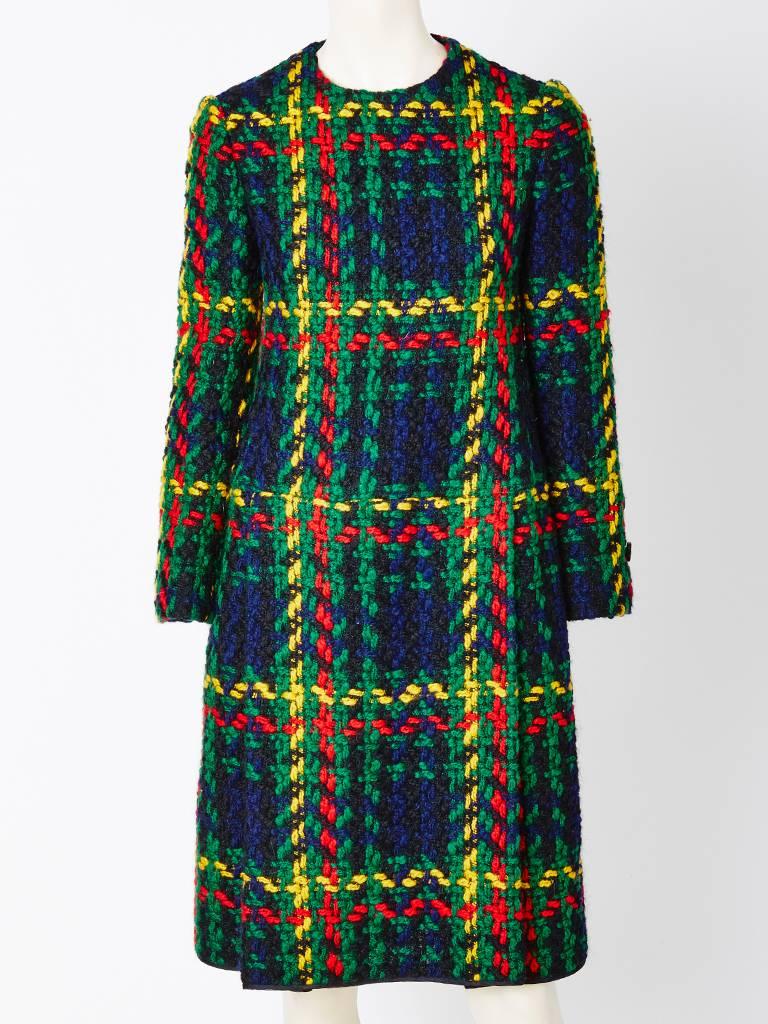 Galanos, wool, shift dress with a matching detactchable scarf. Dress and scarf,
have a wool tweed , bold, graphic plaid pattern. 