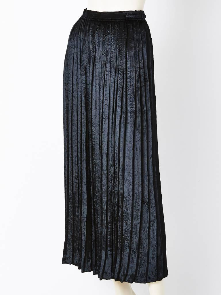 Yves Saint Laurent, black, crushed, panne, velvet, accordion pleated, long skirt.
Narrow waistband with a side zipper closure.