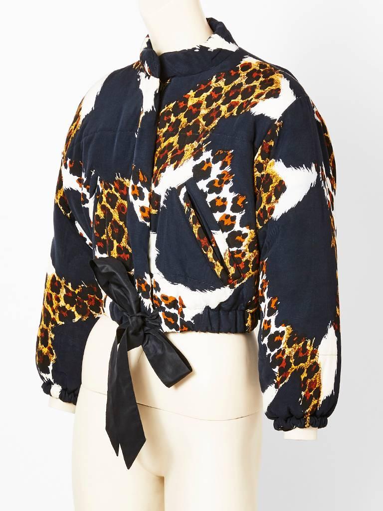 Yves Saint Laurent, leopard print, quilted, faille, blouson, having a rolled, mandarin like collar and a black satin, ribbon, drawstring at the waist.
Hidden zipper closure.