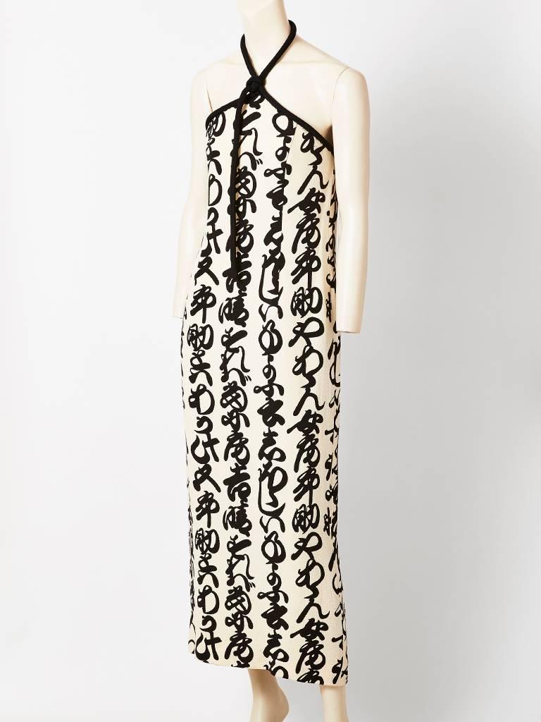 Hanae Mori, cream and black, graphic print dress in a textured crepe having a pattern of Japanese characters. The characters suggest 
