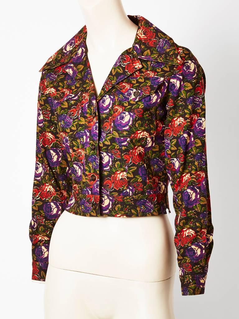 Yves Saint Laurent, floral pattern Jeans Jacket, having a fitted cropped waist, top stitching detail and breast pockets. Button closures.
c.late 70's.