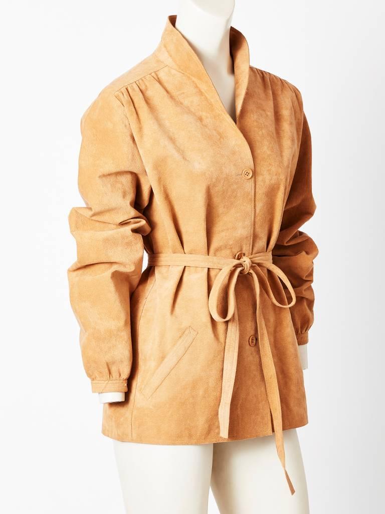 Halston, ultra suede, camel tone, belted jacket, having a shawl collar detail and slash pockets.