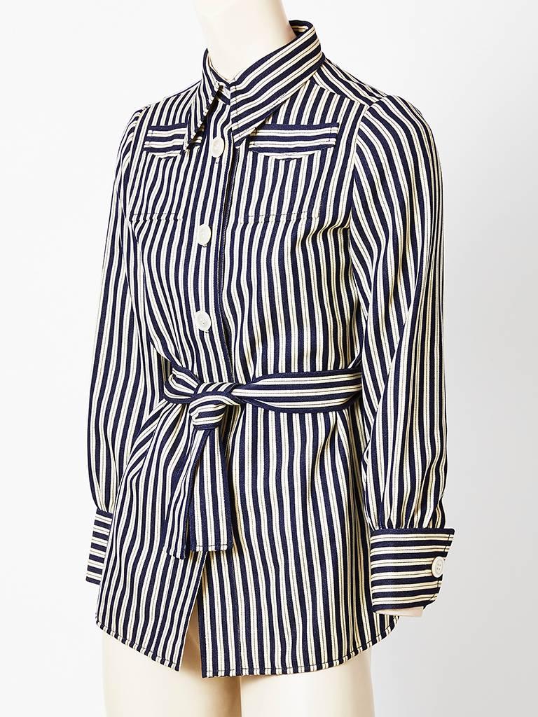 Ognibene Zendman of Rome, navy and white striped, belted blouse/jacket, having a pointed collar, and high placed pocket detail above the bust. C. 1970's.