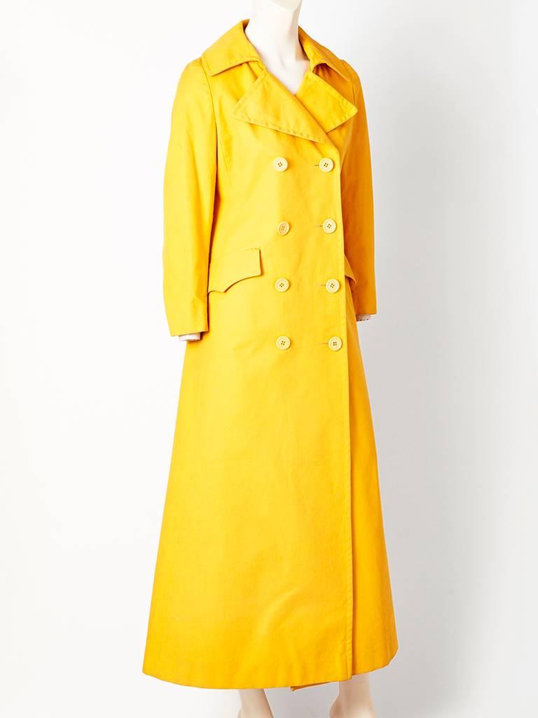 American, chrome yellow, cotton/canvas, double breasted, semi fitted maxi coat, C. 1970's. ( designer unknown).

