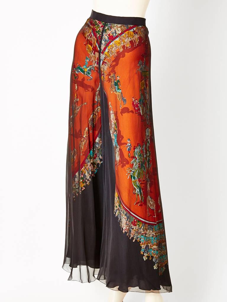 Hermes, layered palazzo pant, having an outer layer of sheer, black, silk chiffon, with an under layer of Hermes patterned silk underneath. The chiffon is sheer enough to expose the beautiful pattern. Chiffon and silk layers are cut on the bias and
